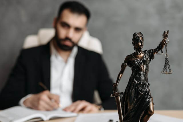 A lawyer working on some documents in his desk